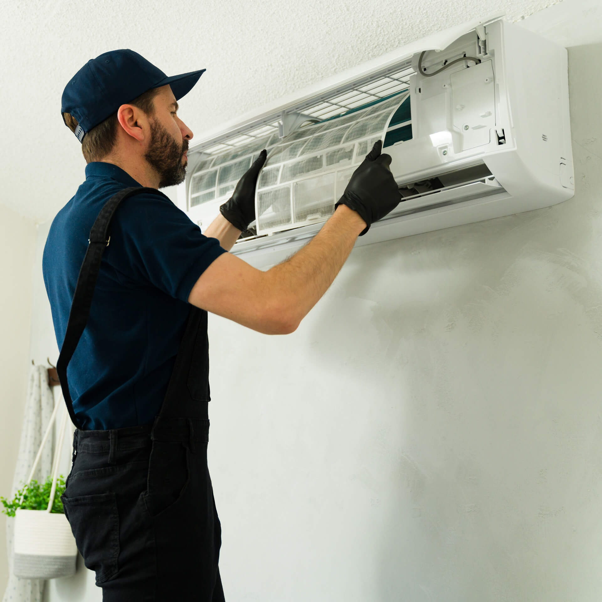 Réparateur climatisation touche filtre